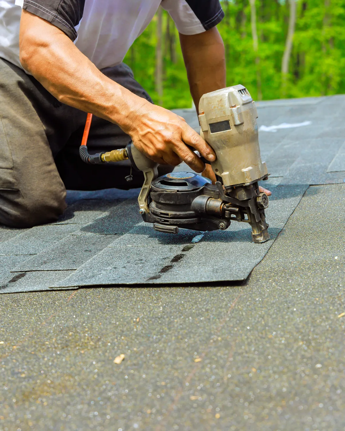 Roofer setting tile on a Castle Pines home