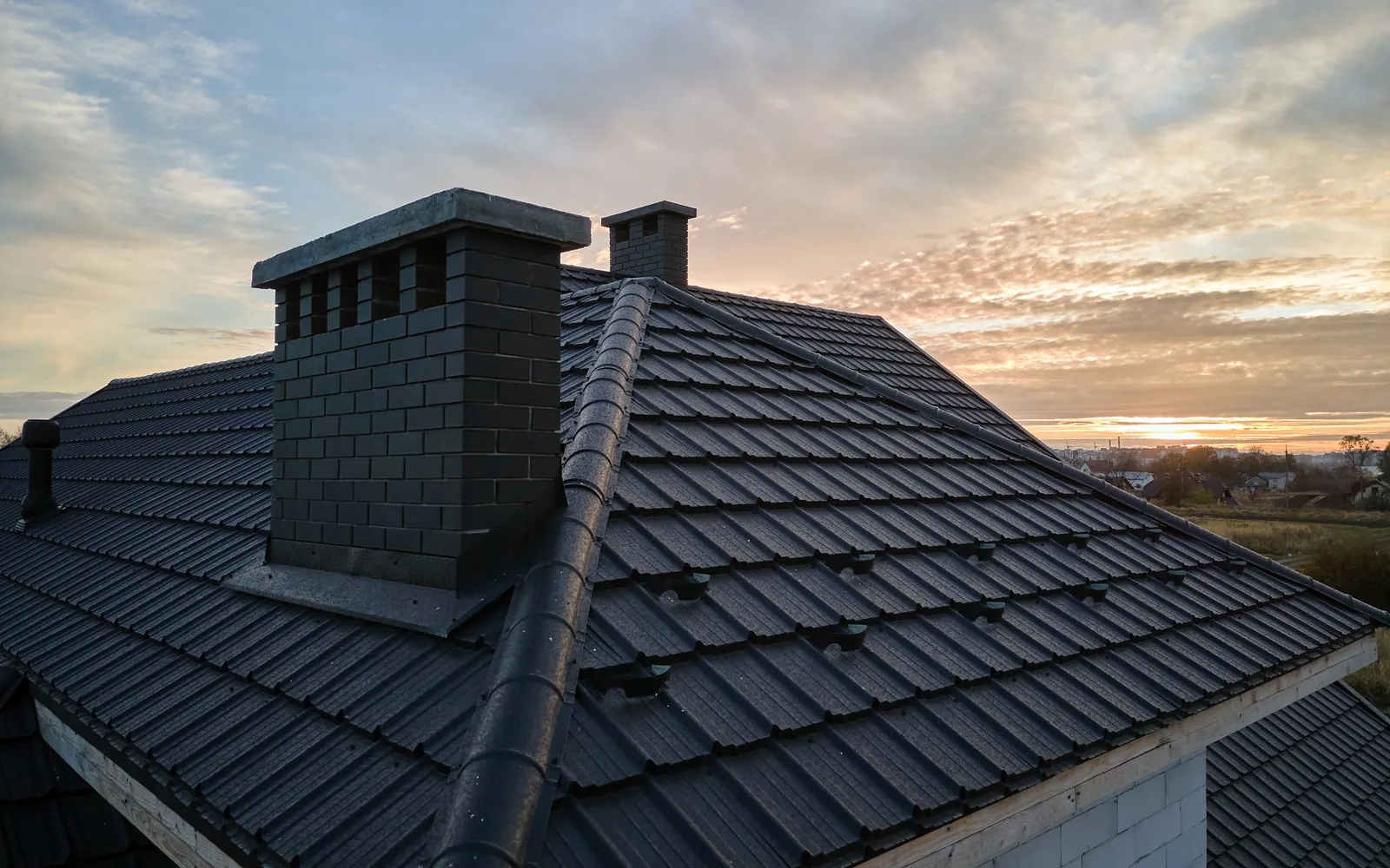 Dark metal roof at sunset